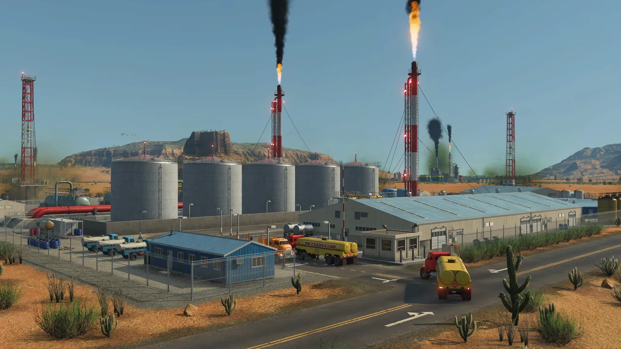 An oil refinery in a desert with storage tanks, flare stacks and tank trucks on the road