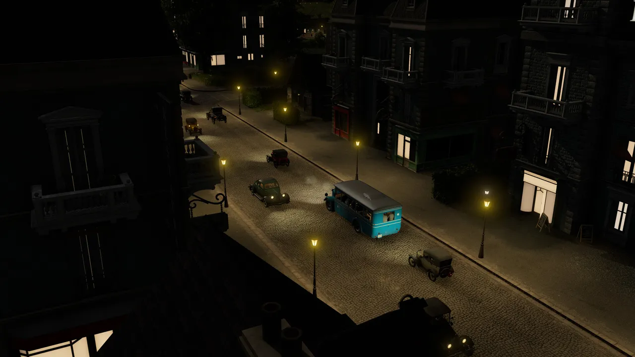 A city street at night lit by lamps, with vintage cars and an old bus between tall dark buildings